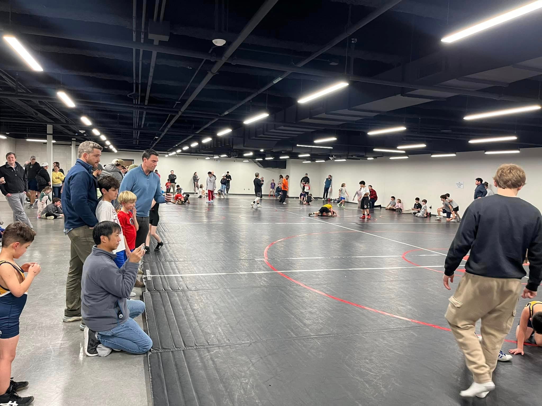 Mustang families and wrestlers gathered at a youth wrestling tournament
